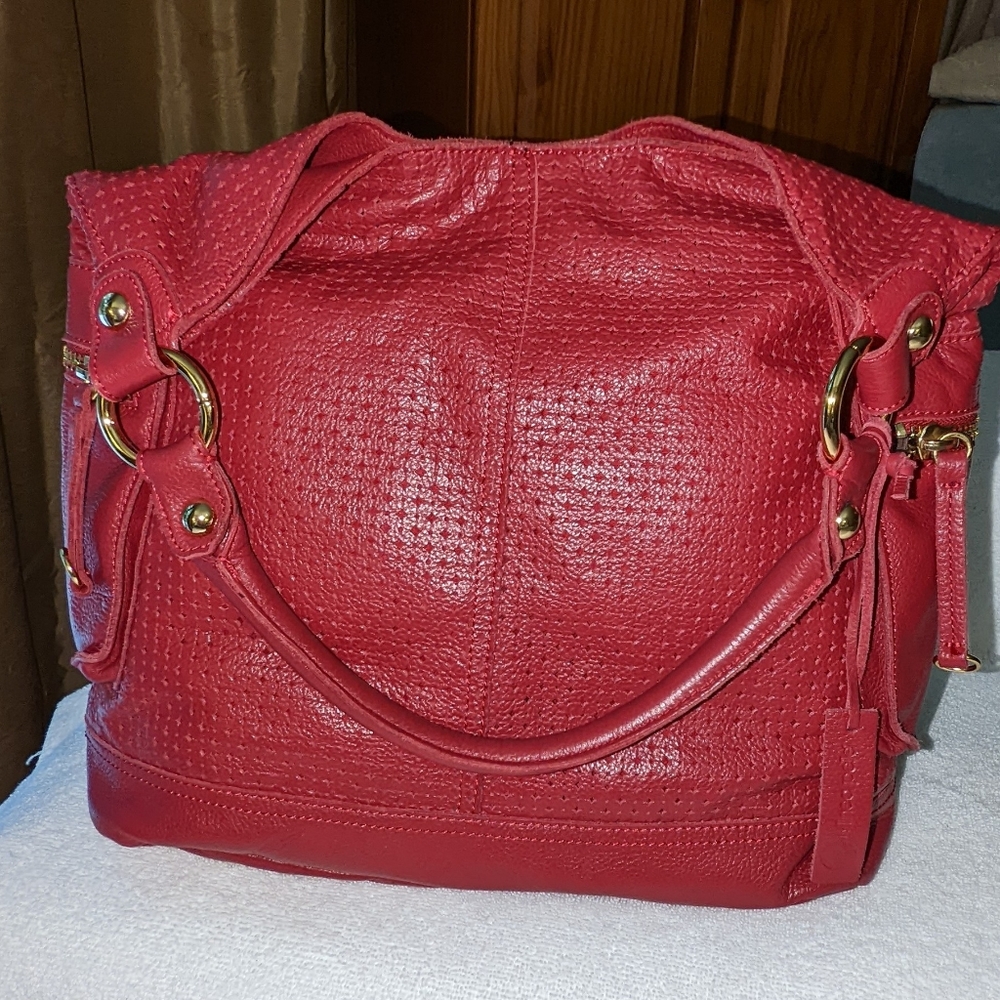 Linea Pelle red leather hobo bag.